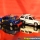 2002 Cadillac Escalade AWD - Full Size Luxury 5-Door SUV 2004 Lightning Strike - New Cars - Real Wheels Series Release 1 4/6 Diecast Scale 1:66 plus 2004 Cadillac Escalade AWD - Full Size Luxury 5-Door SUV 2004 Modern CLUE Series (Mrs. Peacock) 3/6 Diecast Scale 1:66 by Johnny Lightning